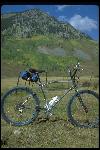 Cook Brothers bike standing in field, Crested Butte, CO, September 1979. Built in Santa Ana, CA. Owned by Chris Carroll of Bicycles, Etc., Crested Butte, CO. Chrome plated, blue parts. Static side view