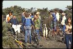 Top of Repack, discussing start times, socializing and releasing prerace tensions. More than 20 people including Bob Burrowes, with Marin County Klunkers T shirt, Les Degan, Wende Cragg, loading film , January 1979. 